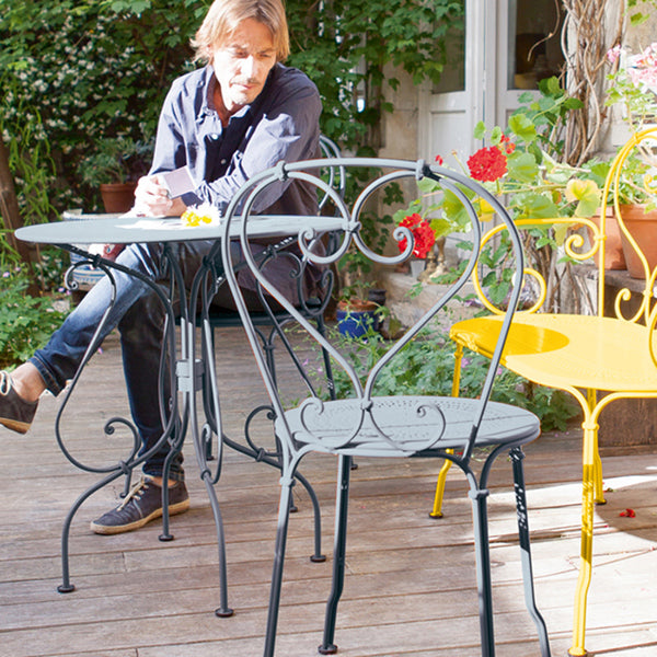 1900 Stacking Chair by Fermob, live shoot of the chair with table.