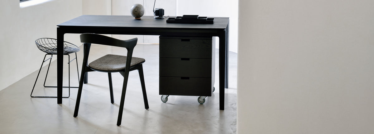 Billy Drawer Unit by Ethnicraft, showing front view of black oak drawer unit in live shot.