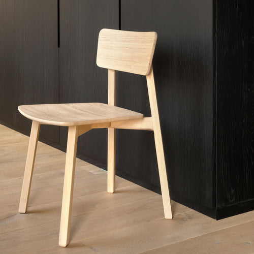 Casale Dining Chair by Ethnicraft, showing side view of dining chair in the live shot.