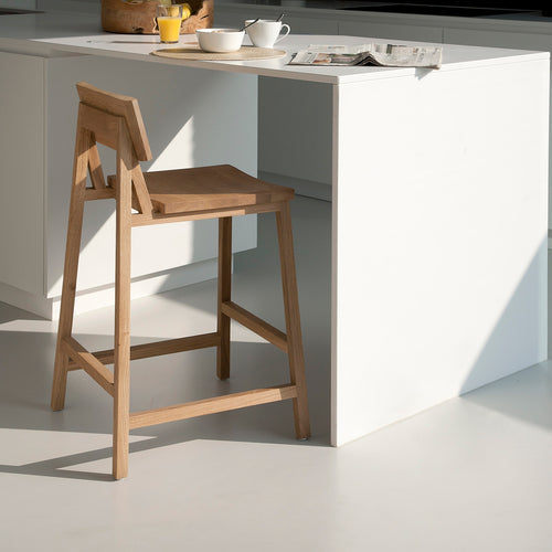 N3 Kitchen Oak Counter Stool by Ethnicraft, showing angle view of n3 kitchen counter stool in live shot.