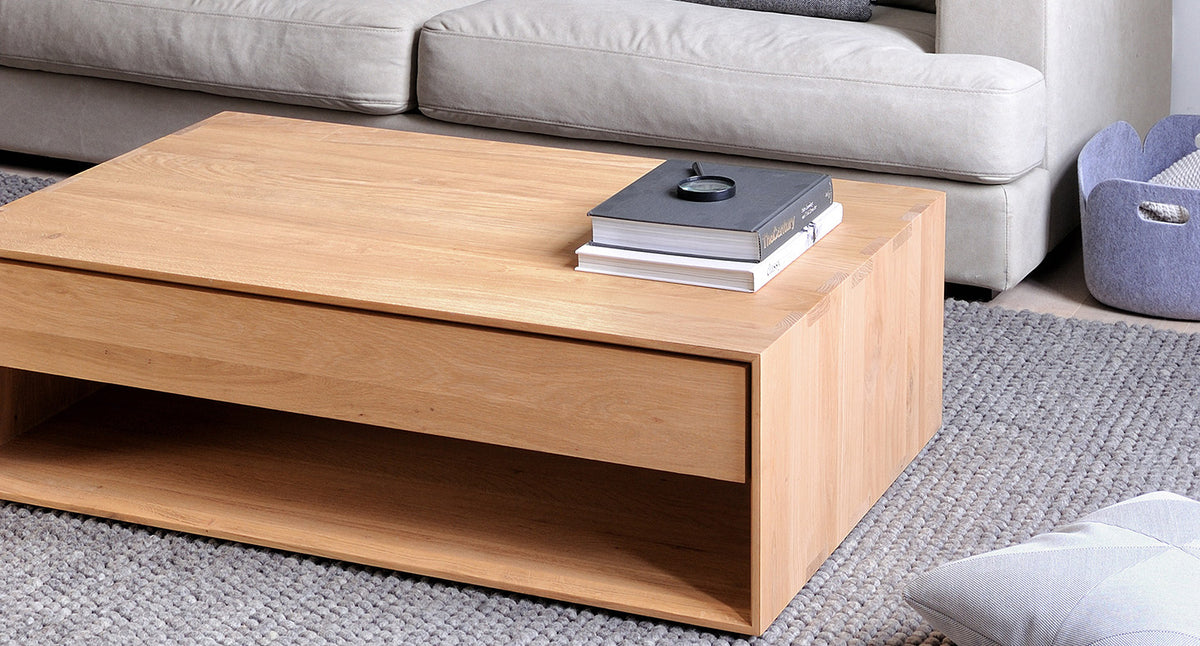 Nordic Coffee Table by Ethnicraft, showing angle view of oak coffee table - 47" in live shot.