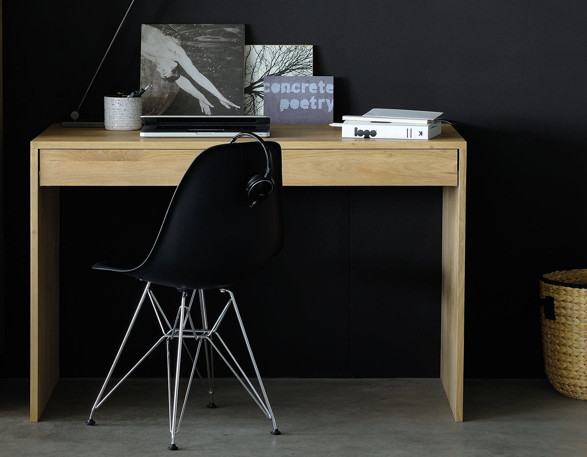 Wave Office Console by Ethnicraft, showing front view of oak office console and chair in live shot.