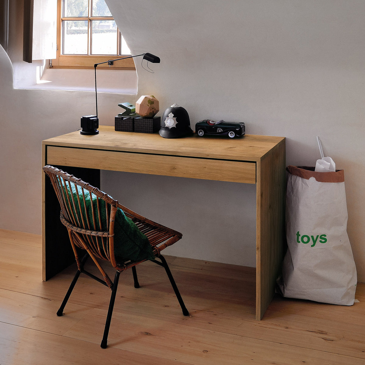 Wave Office Console by Ethnicraft, showing angle view of oak office console and chair in live shot.