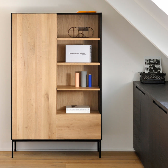 Blackbird Oak Storage Cupboard by Ethnicraft, showing front & open view of storage cupboard with table in the live shot.