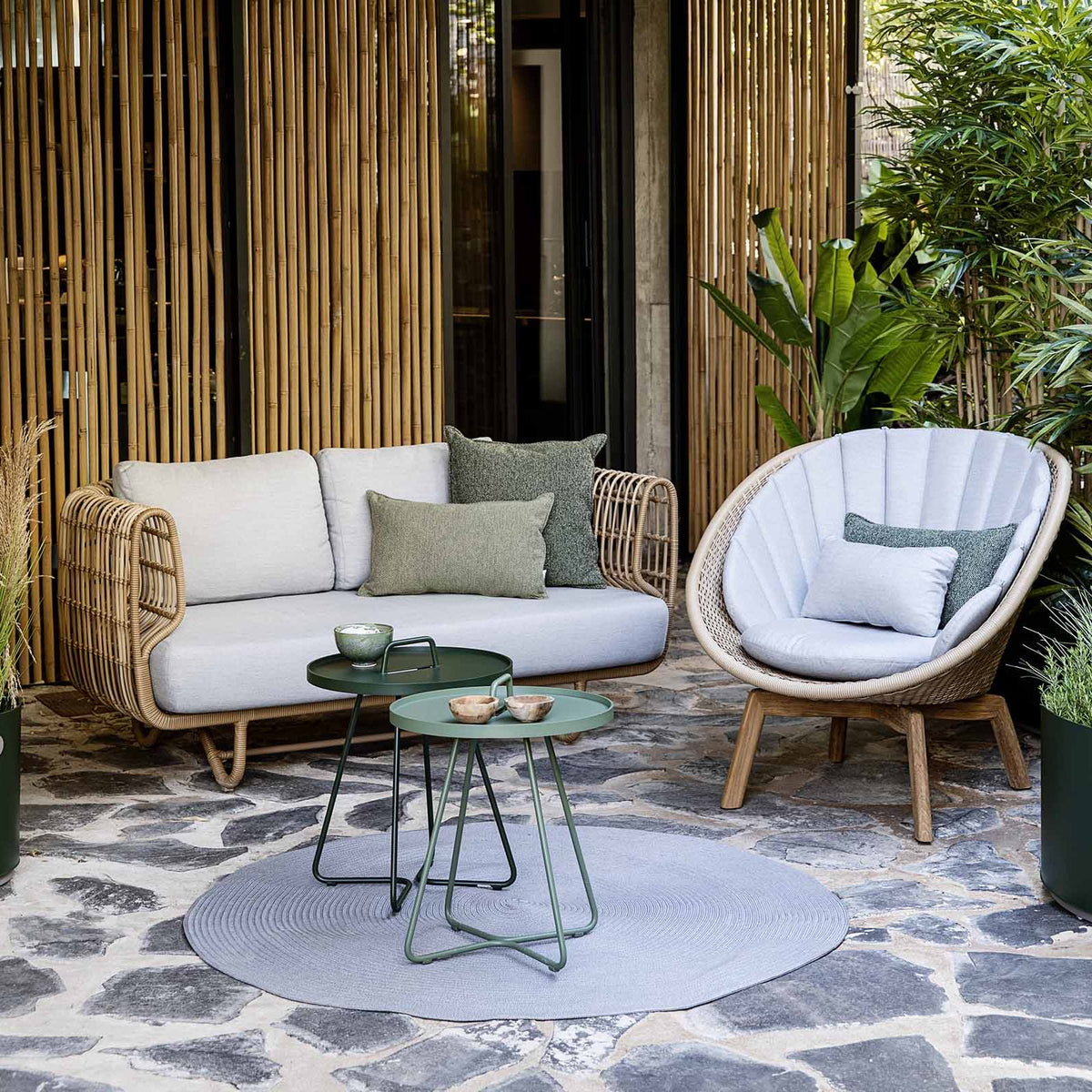 Nest Outdoor Sofa by Cane-Line, showing nest outdoor sofa in the live shot.