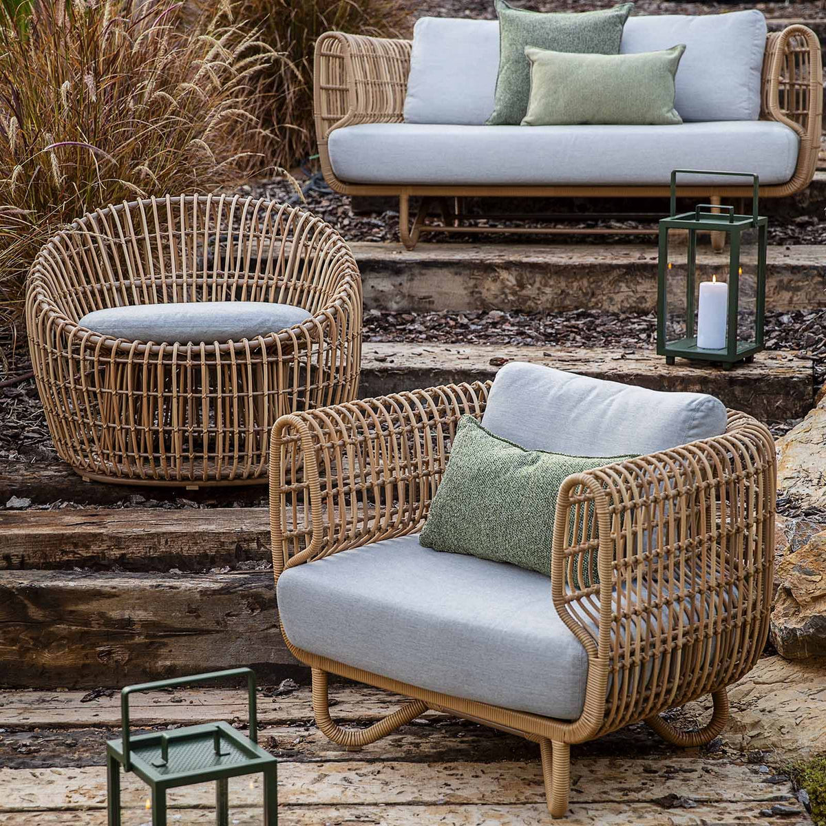 Nest Outdoor Sofa by Cane-Line, showing nest outdoor sofa in the live shot.