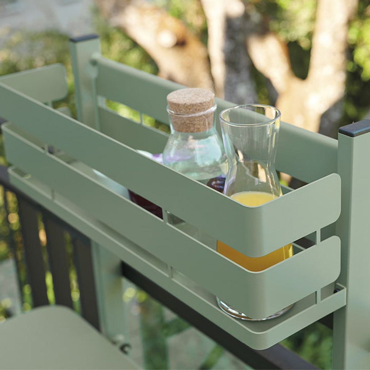 Bistro Balcony Table by Fermob, showing closeup view of bistro balcony table in live shot.