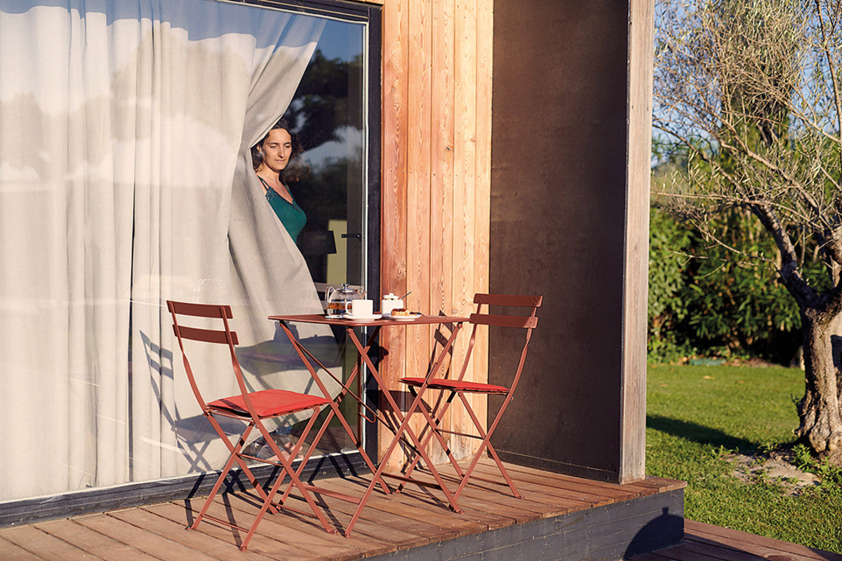 Bistro Chair Cushion by Fermob, showing bistro chair cushion in live shot.