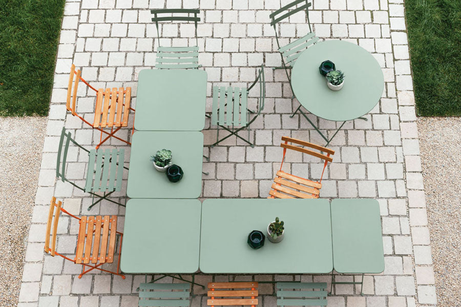 Bistro Tables by Fermob, showing of bistro tables with chairs in the live shot.
