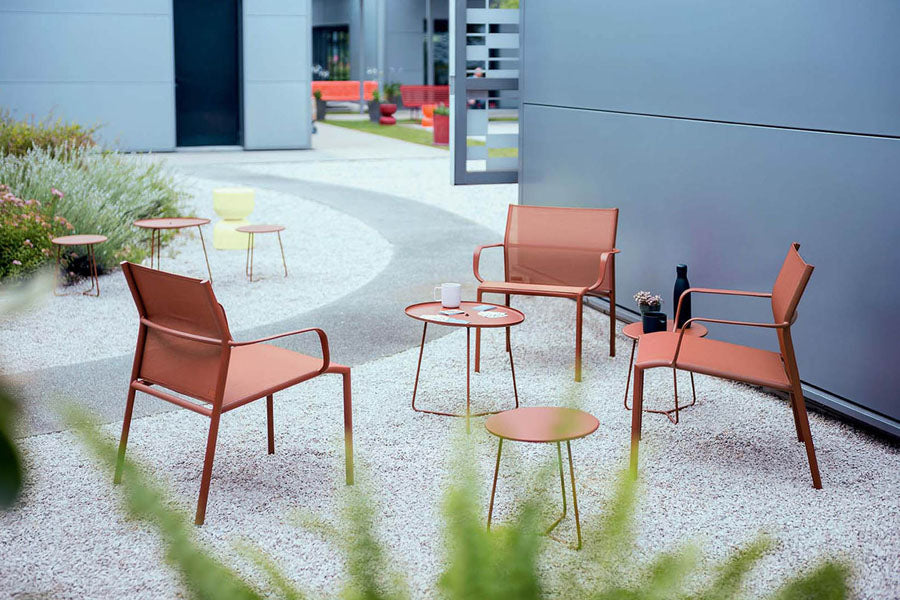 Cadiz Low Armchair (Set of 4) by Fermob, showing cadiz low armchair (set of 4) in live shot.