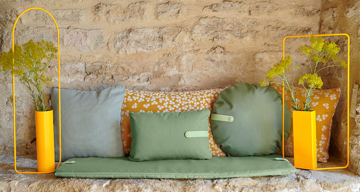Color Mix Bench Outdoor Cushion by Fermob, showing color mix bench outdoor cushion in live shot.