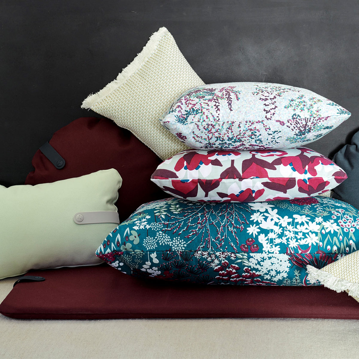 Color Mix Bench Outdoor Cushion by Fermob, showing color mix bench outdoor cushion in live shot.