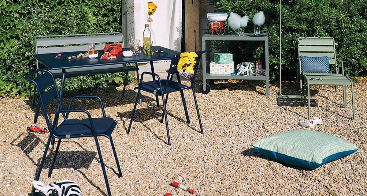 Color Mix Luxembourg Outdoor Cushion by Fermob, showing color mix luxembourg outdoor cushion in live shot.