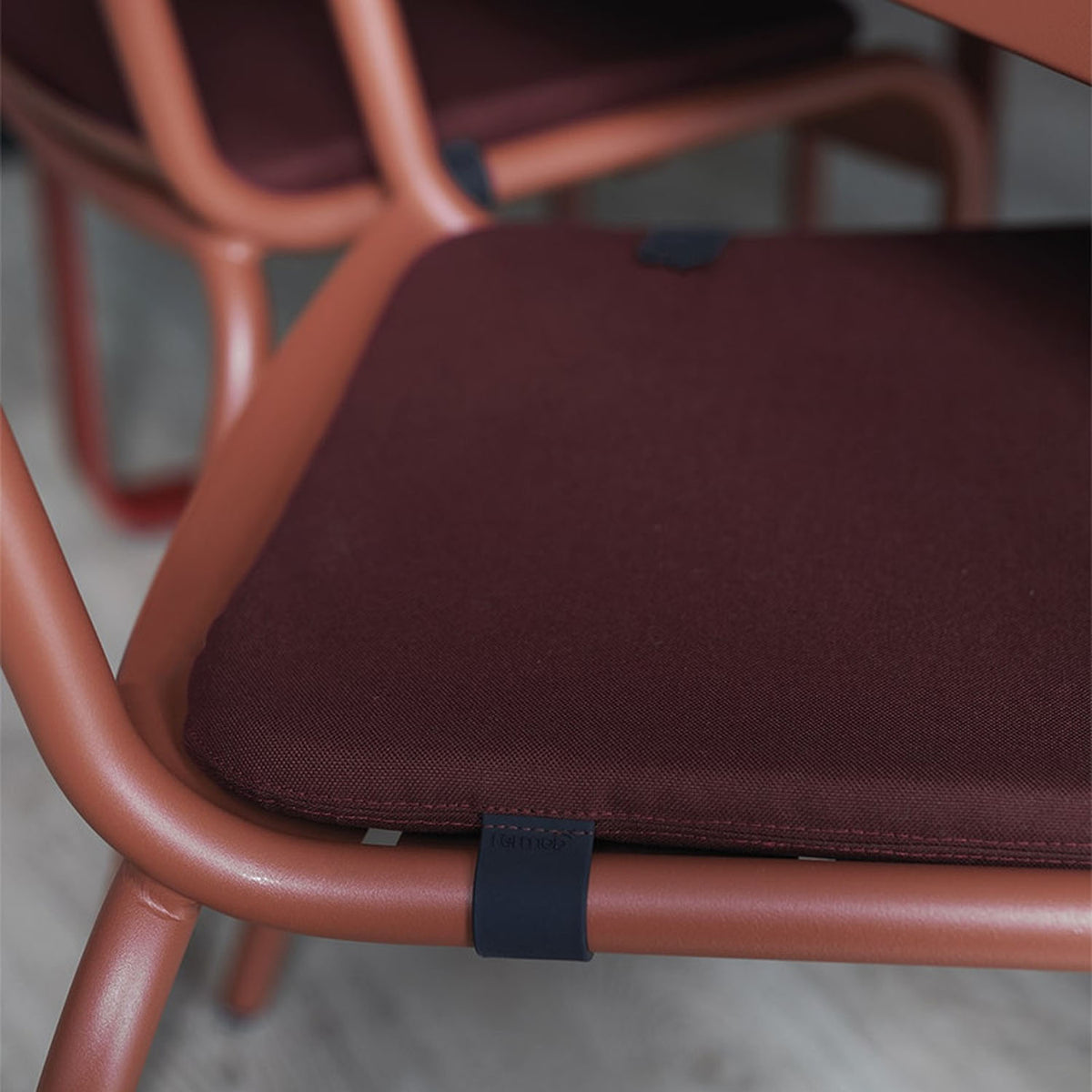 Color Mix Luxembourg Outdoor Cushion by Fermob, showing closeup view of color mix luxembourg outdoor cushion in live shot.