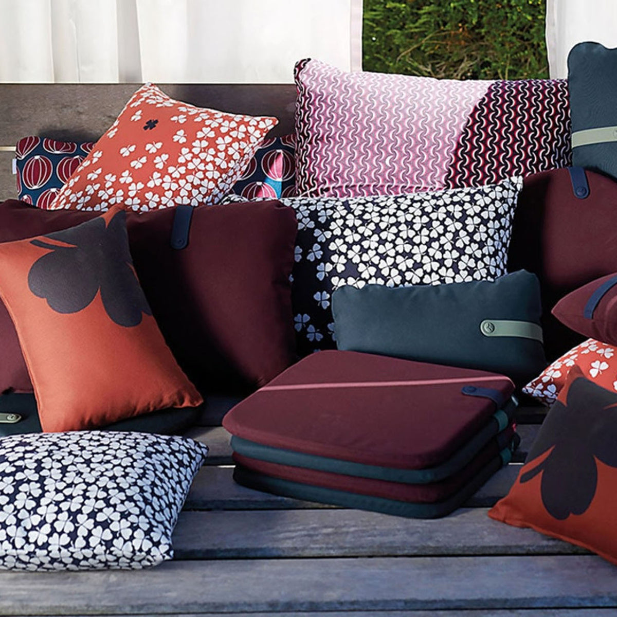 Color Mix Luxembourg Outdoor Cushion by Fermob, showing color mix luxembourg outdoor cushion in live shot.