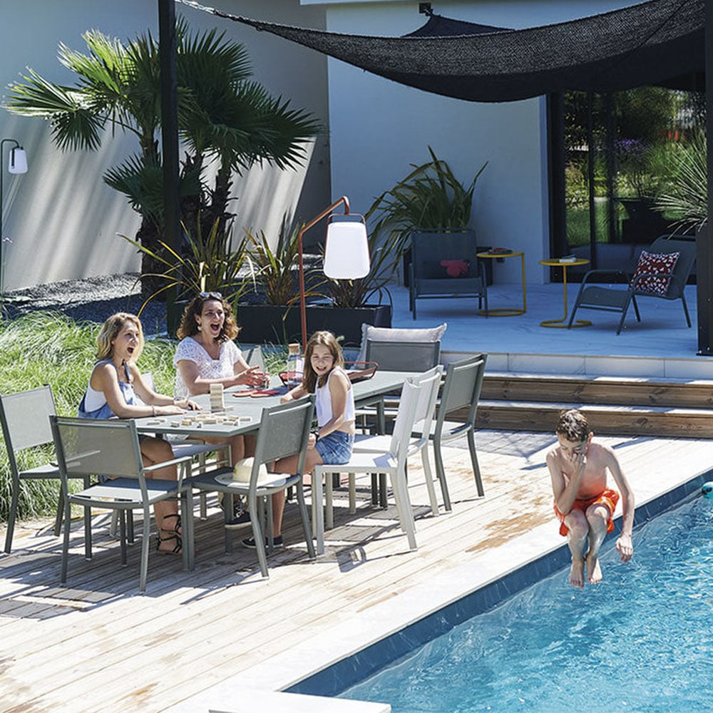 Costa Extending Dining Table by Fermob, showing costa extending dining table in live shot.