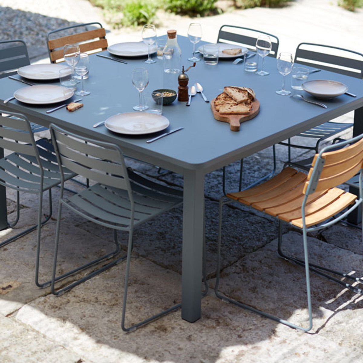 Craft Dining Table by Fermob, showing craft dining table in live shot.