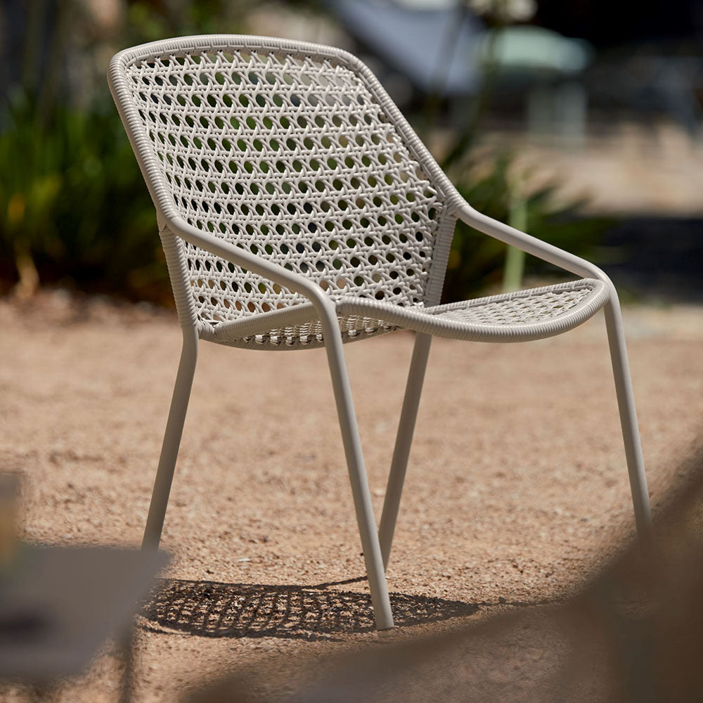 Croisette Armchair (Set of 4) by Fermob, showing croisette armchair (set of 4) in live shot.