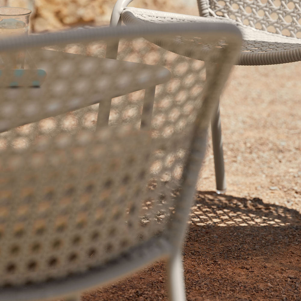 Croisette Armchair (Set of 4) by Fermob, showing closeup view of croisette armchair (set of 4) in live shot.