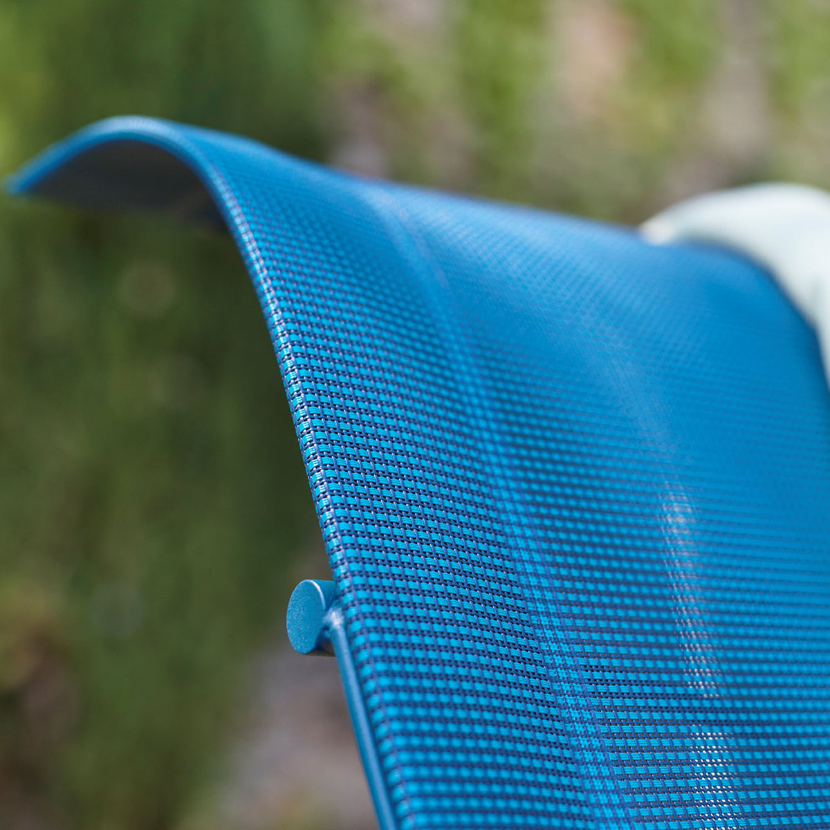 Dune Sunlounger by Fermob, showing closeup view of dune sunlounger in live shot.
