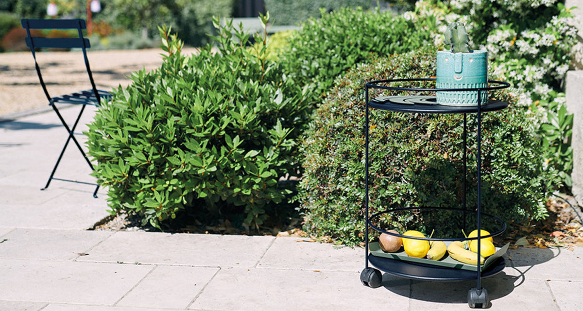 Guinguette Side Table with Wheels by Fermob, showing guinguette side table with wheels in live shot.