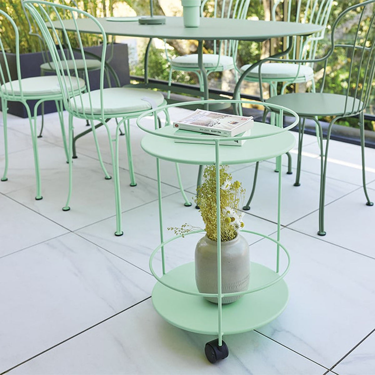 Guinguette Side Table with Wheels by Fermob, showing guinguette side table with wheels in live shot.