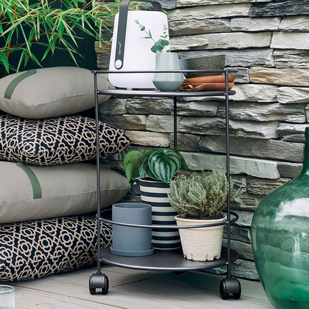 Guinguette Side Table with Wheels by Fermob, showing guinguette side table with wheels in live shot.