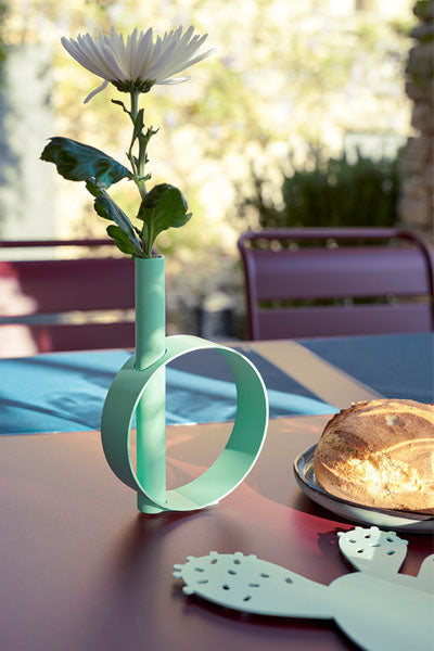 Ios Single Stem Vase by Fermob, showing ios single stem vase in live shot.