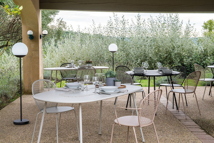 Lorette Oval Table by Fermob, showing lorette oval table in live shot.