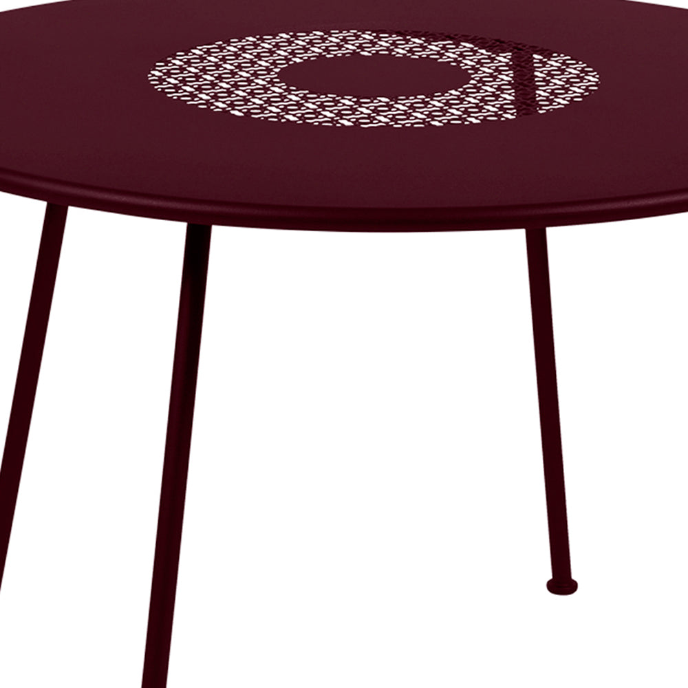Lorette Round Table by Fermob, showing closeup view of lorette round table.