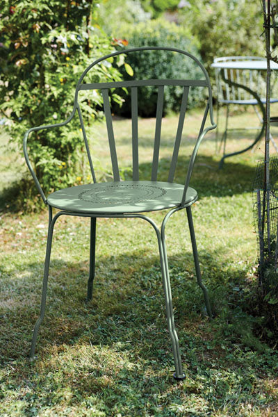 Louvre Armchair by Fermob, showing louvre armchair in live shot.