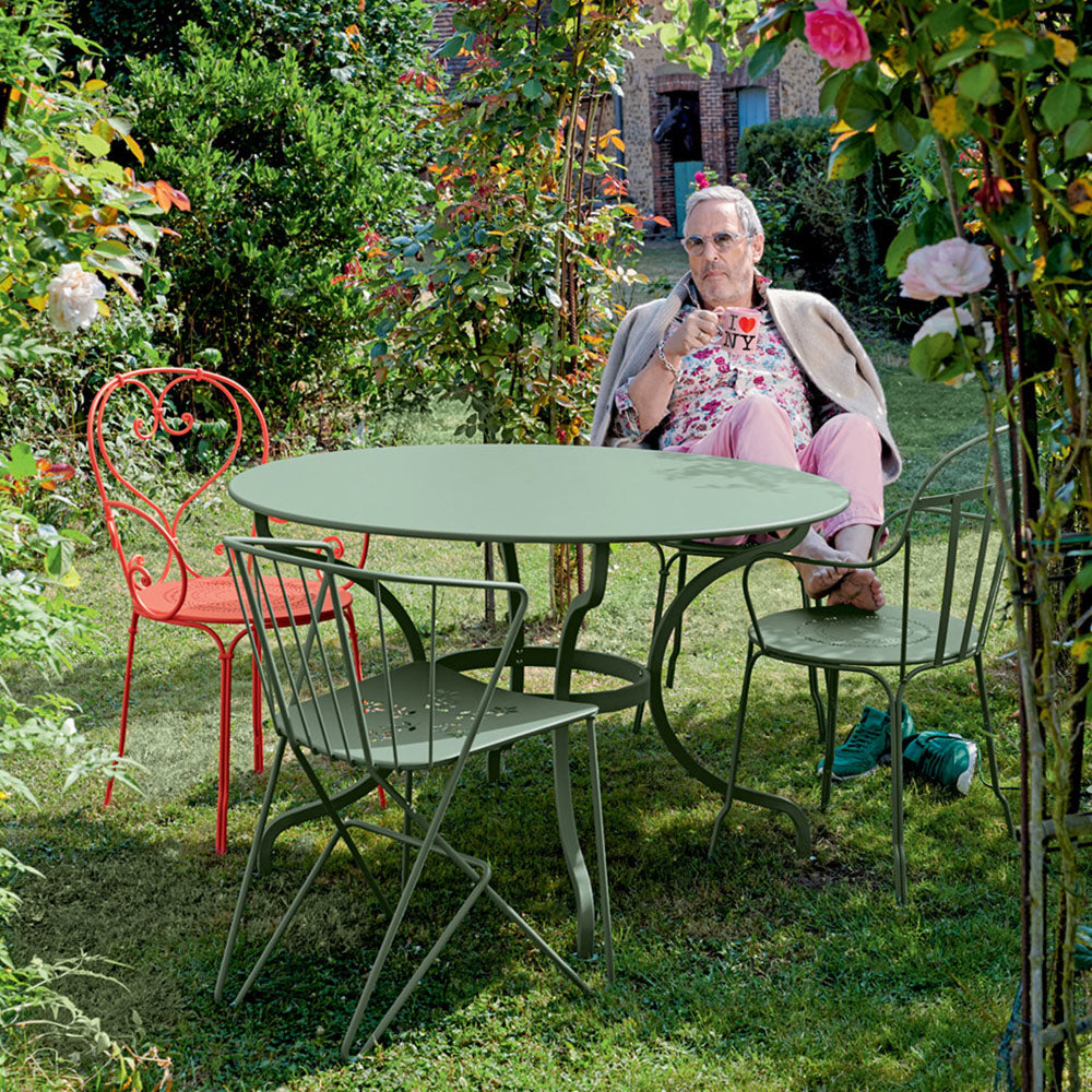Louvre Armchair by Fermob, showing louvre armchair in live shot.