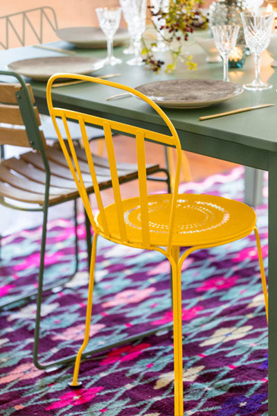 Louvre Side Chair by Fermob, showing louvre side chair in live shot.