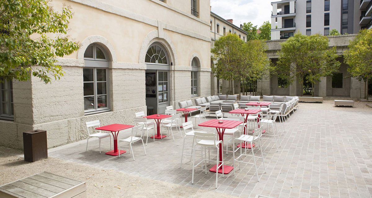 Luxembourg High Pedestal Table by Fermob, showing luxembourg high pedestal table in live shot.