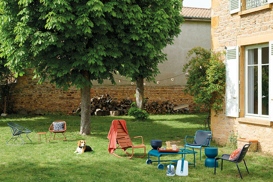 Luxembourg Rocking Chair by Fermob, showing rocking chair with low tables & chairs in live shot