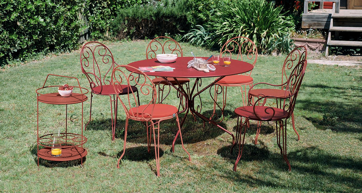 Montmartre Armchair by Fermob, showing montmartre armchair in live shot.