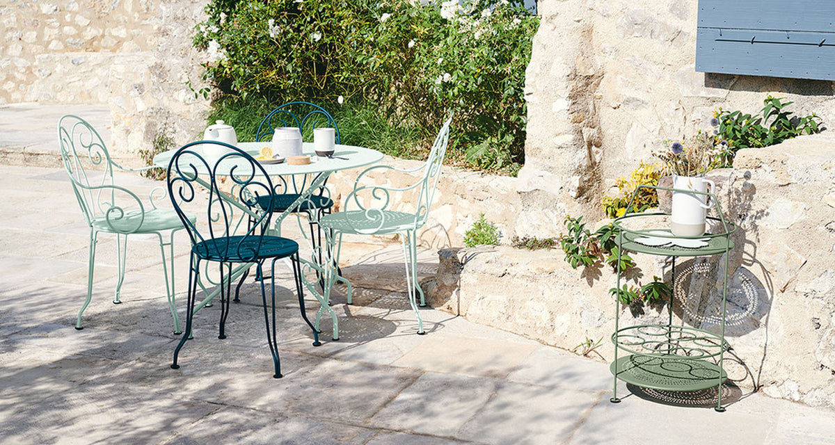 Montmartre Perforated Tables by Fermob, showing montmartre perforated tables in live shot.