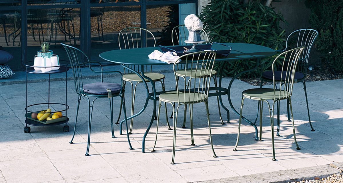 Opera+ Oval Table by Fermob, showing opera+ oval table in live shot.
