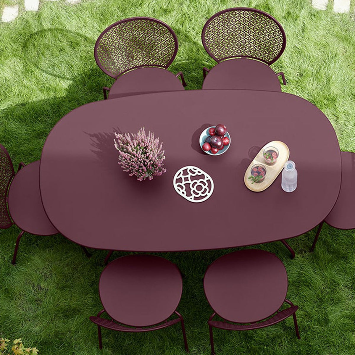 Opera+ Oval Table by Fermob, showing opera+ oval table in live shot.