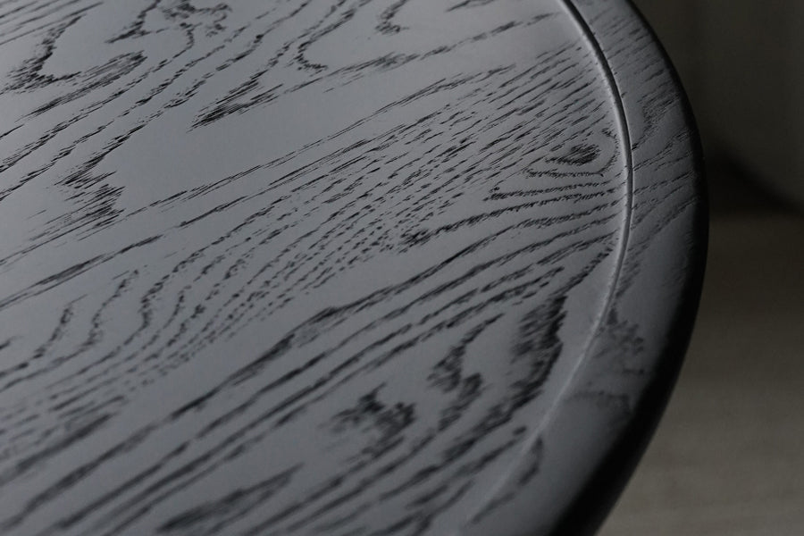 Accent Dining Table by Mater, showing closeup view of accent dining table in live shot.