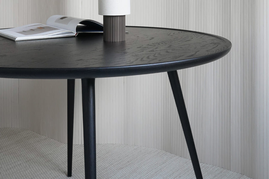 Accent Dining Table by Mater, showing closeup view of accent dining table in live shot.