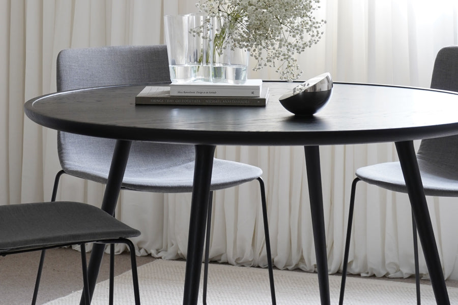 Accent Dining Table by Mater, showing closeup view of accent dining table with chairs in live shot.