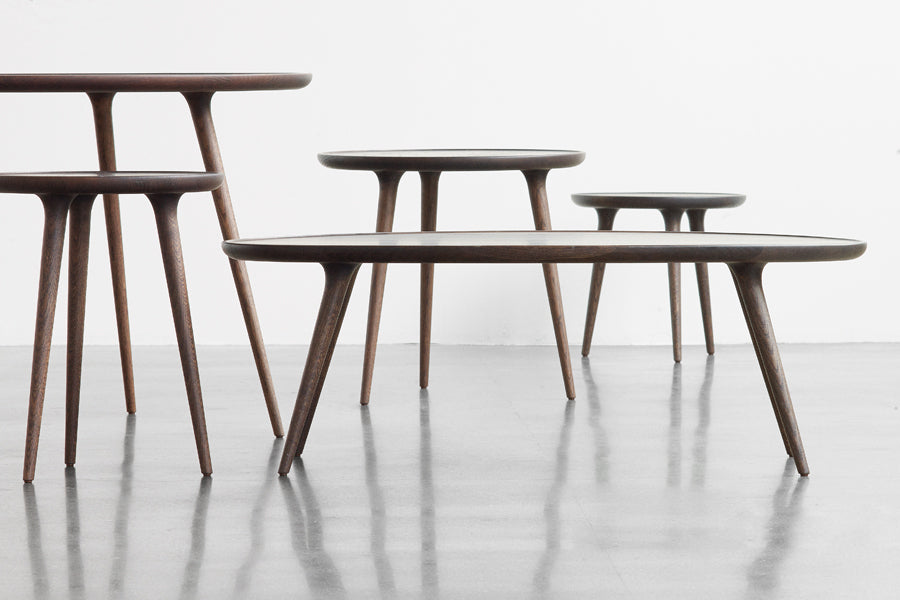 Accent Dining Table by Mater, showing accent dining table with different accent tables in live shot.