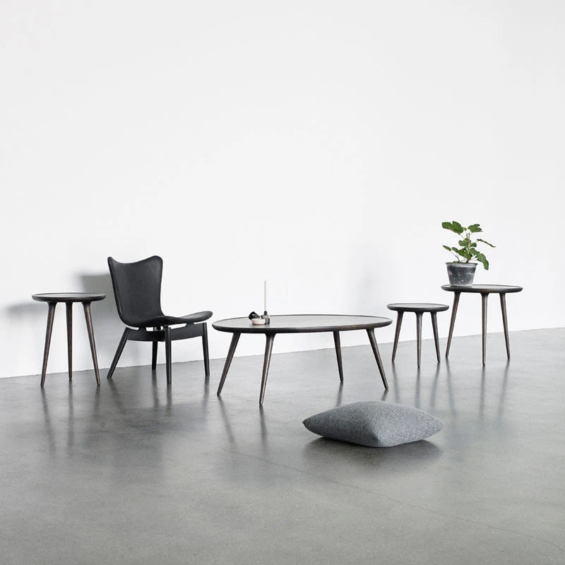 Accent Sofa Table by Mater, showing accent sofa table with different accent tables & chair in live shot.