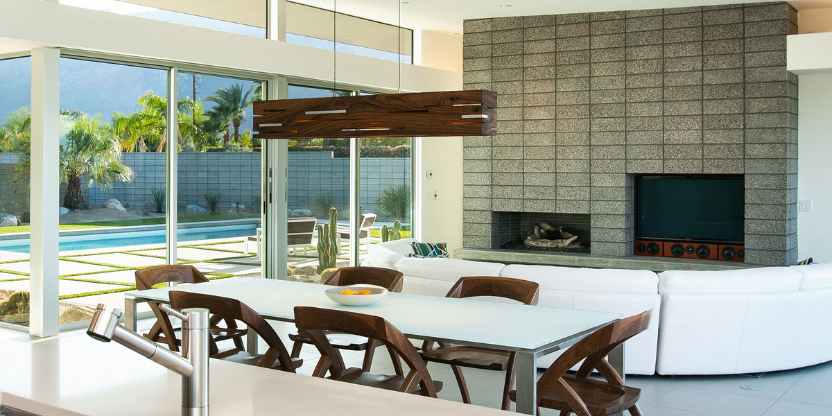 Aeris LED Linear Pendant by Cerno, showing aeris led linear pendant with table & chairs in live shot.