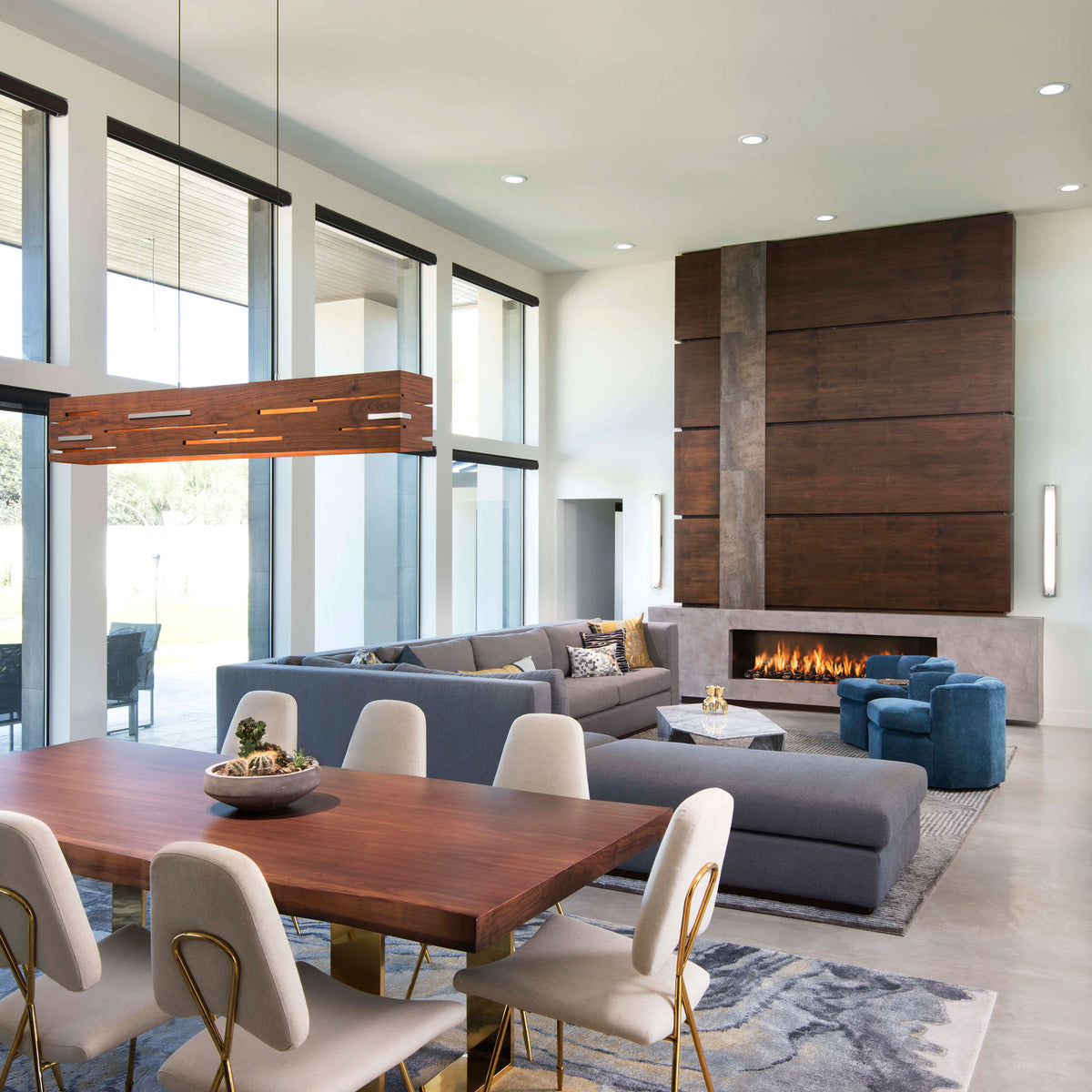 Aeris LED Linear Pendant by Cerno, showing aeris led linear pendant with table & chairs in live shot.