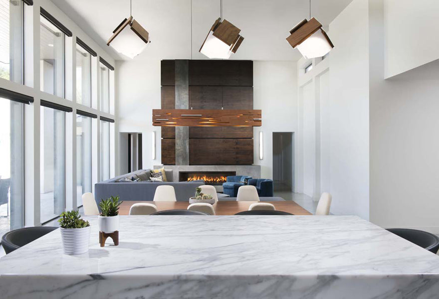 Aeris LED Linear Pendant by Cerno, showing aeris led linear pendant with sofa, table & chairs in live shot.