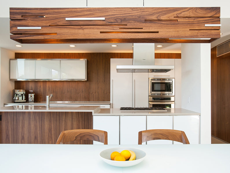 Aeris LED Linear Pendant by Cerno, showing aeris led linear pendant with table & chairs in live shot.