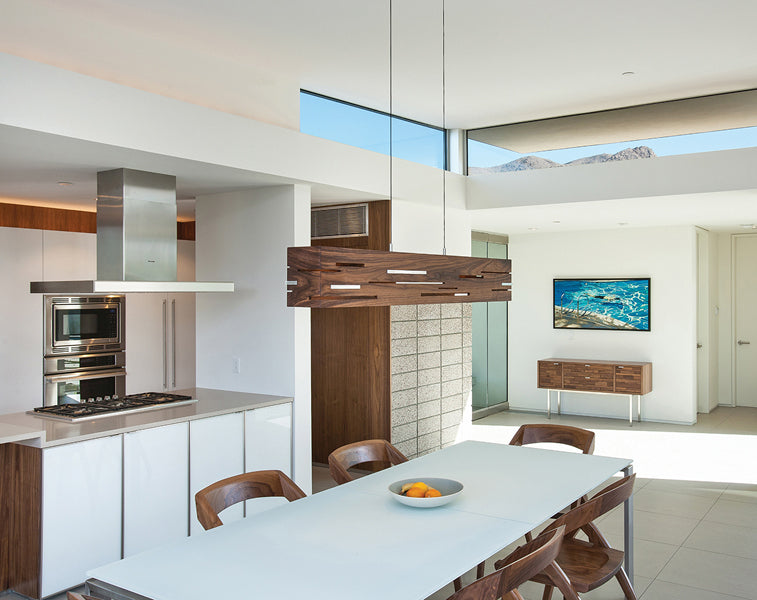 Aeris LED Linear Pendant by Cerno, showing aeris led linear pendant with table & chairs in live shot.