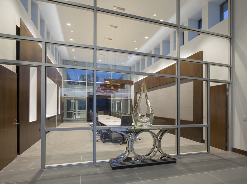 Aeris LED Linear Pendant by Cerno, showing aeris led linear pendants with table & chairs in live shot.